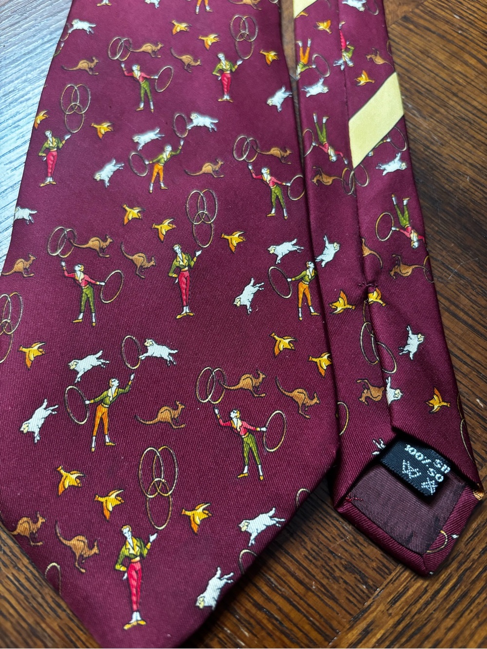burgundy Salvatore Ferragamo 100% silk necktie featuring a playful novelty print